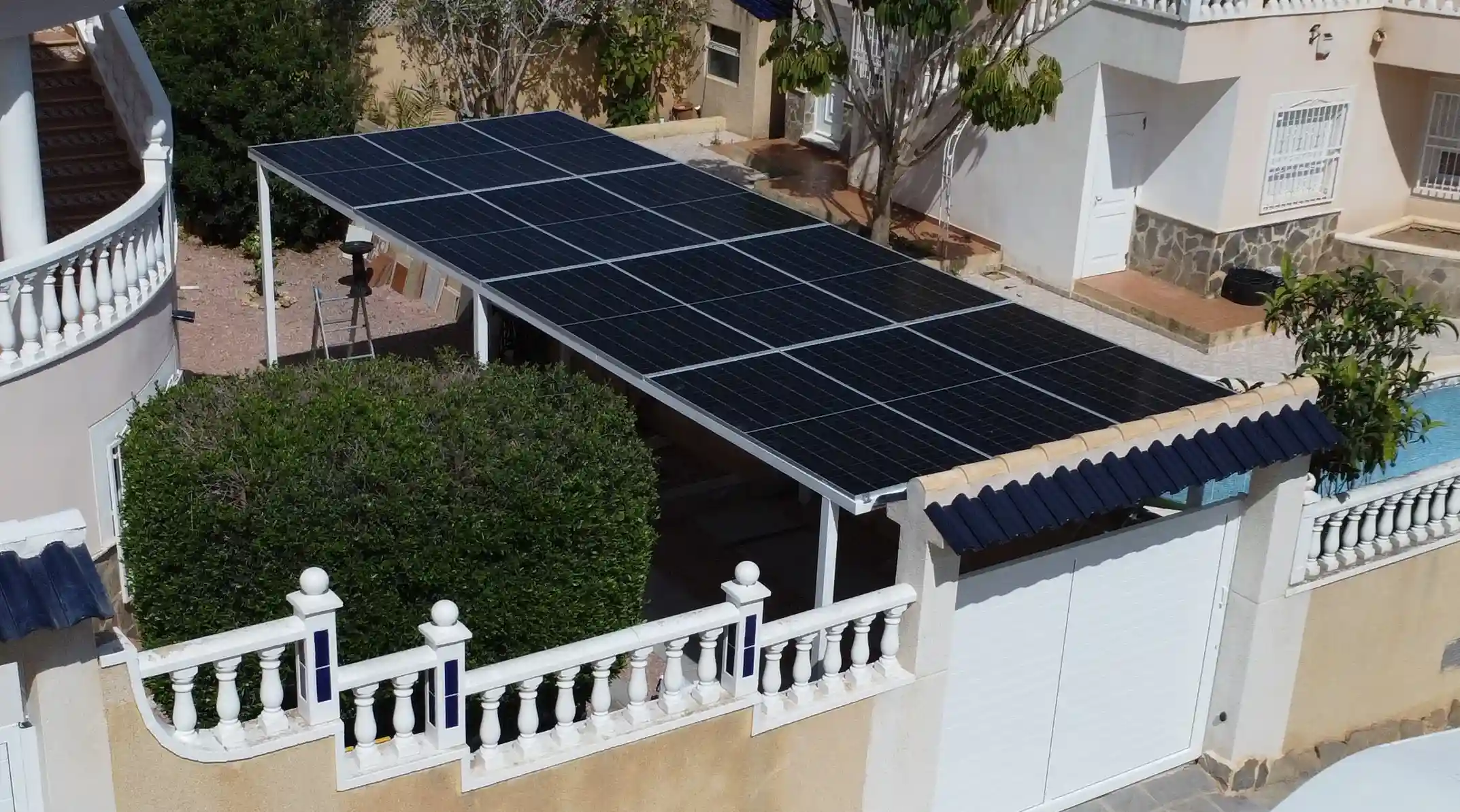 Double carport solar providing shaded parking and solar power for two vehicles